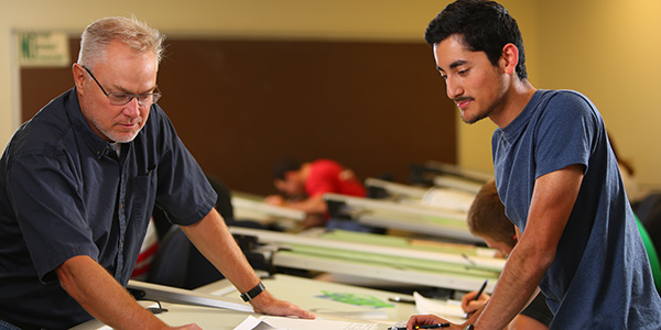 Faculty member working with student