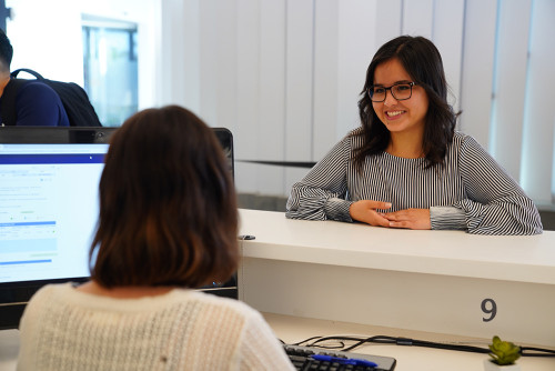 Staff member talking to student