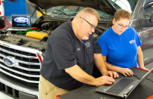 Steve Skroch shows Taylor Schadick Ford ACE program. 