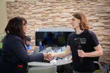 MCC President, Dr. Tammy Robinson, greets iBelong student during iPad checkout event. 