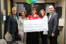 Julie Garner receives large check.