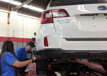 MCC students work on Subaru vehicle.