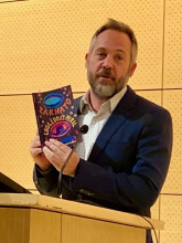 Todd Alan Fredson, Ph.D., Mesa Community College English faculty,with his book Zakwato &amp; Loglêdous Peril